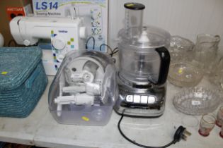 A Dualit food processor with various attachments