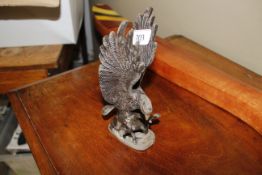 A bronzed figure of an eagle