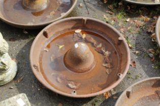 A cast iron pig trough