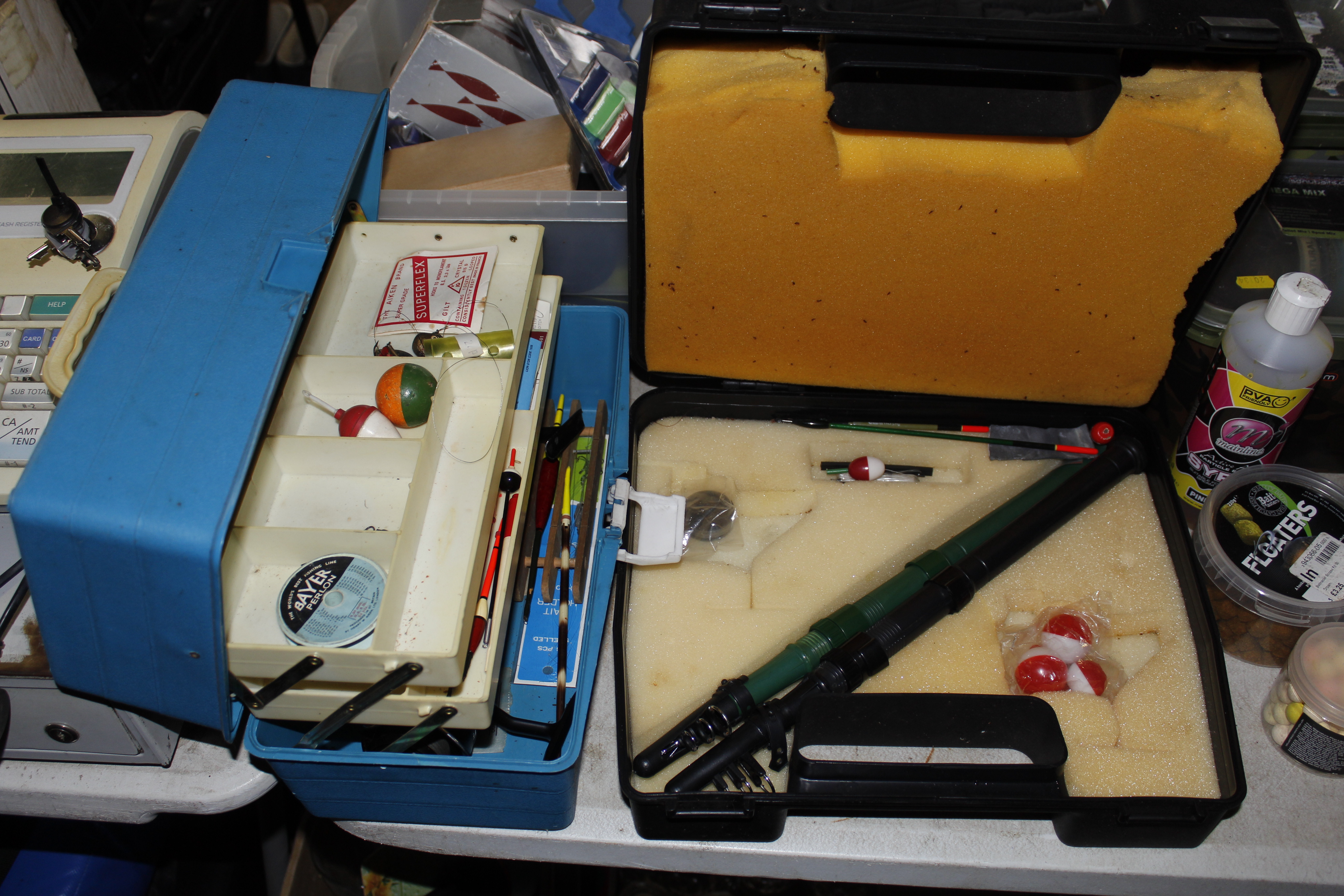Two fishing tackle boxes and contents of telescopic rods etc.