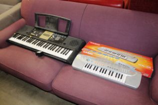 A Casio keyboard and a Yamaha keyboard