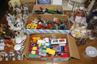 Three boxes of various play worn die cast toys, mo