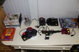 A quantity of various vintage games and gaming items to including Fighter stick MD-6, Quickshot,