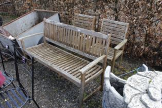 A hardwood garden bench and two matching chairs