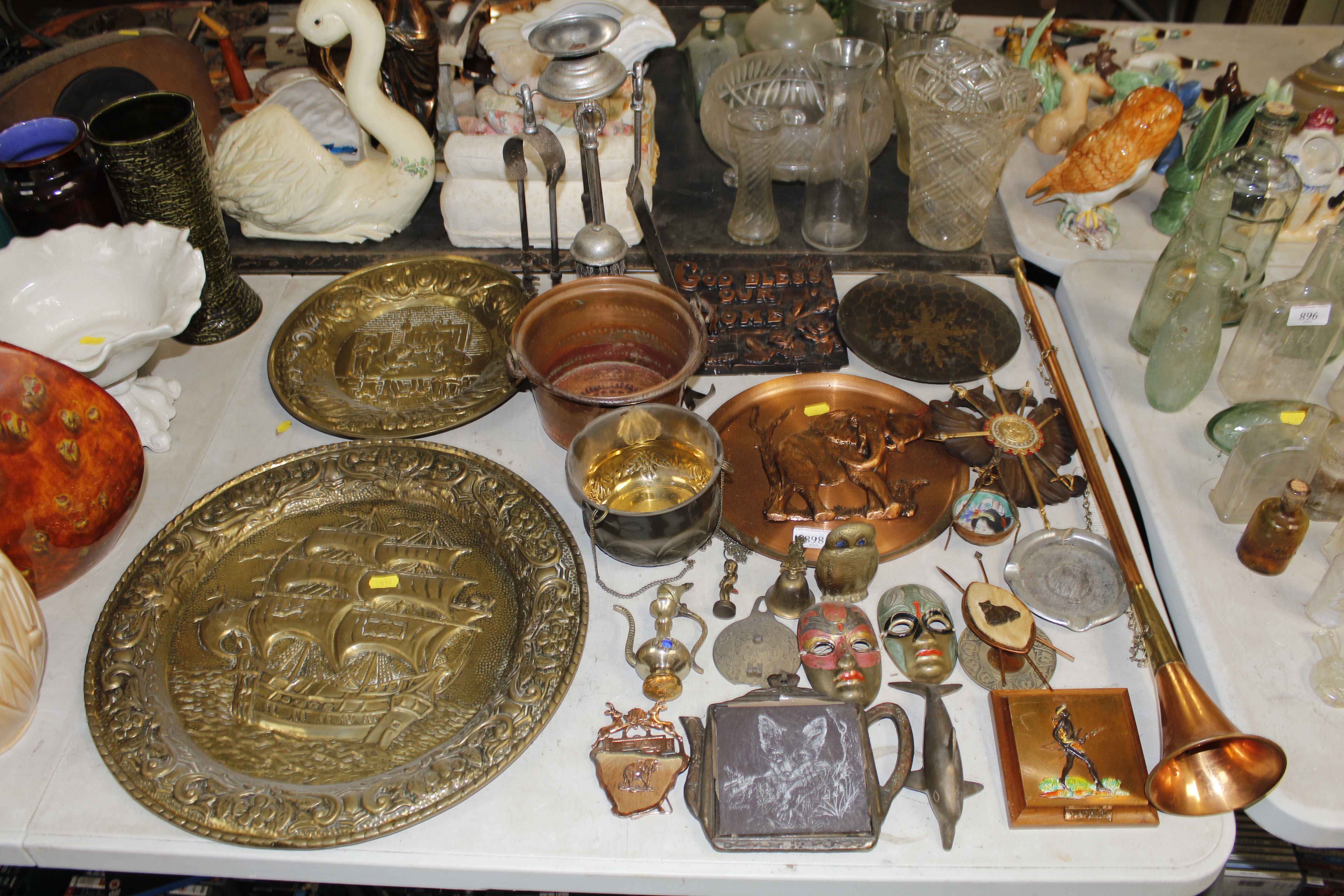 A collection of various brass and copper ornaments