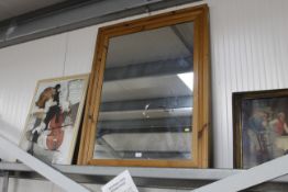 A large pine framed wall mirror