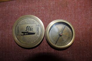 A brass pocket compass with Titanic decoration