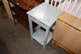 A painted two tier occasional table fitted single