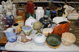 A collection of various pottery vases, stoneware s