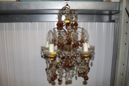 A five light chandelier with coloured and clear gl