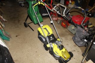 A Ryobi Easy Edge lithium 18 volt battery powered lawnmower with two 18 volt lithium batteries and