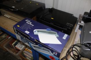 A paper binding machine and an Epson SX130 printer