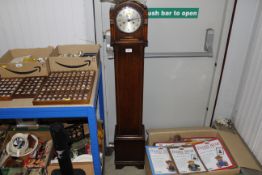 A 1930s oak cased grandmother clock