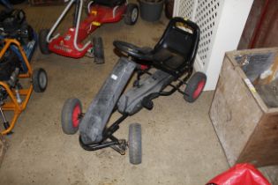 A child's pedal go-cart