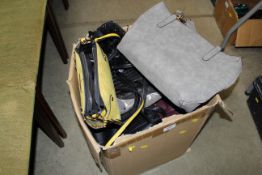 A box of miscellaneous handbags