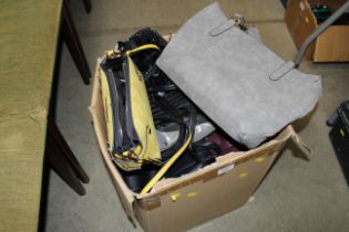 A box of miscellaneous handbags