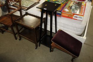 A two tier plant stand, an oak two tier trolley an