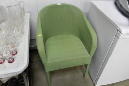 A green painted loom arm chair