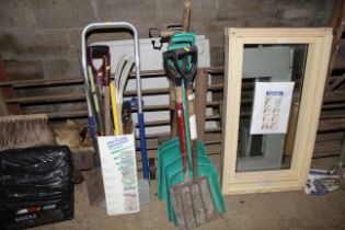 A quantity of gardening tools to include shovels,