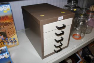 A nest of metal filing drawers