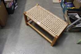 An oak and string seated stool