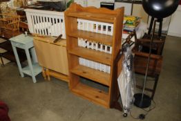 A set of stripped pine open fronted bookshelves