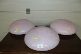Three pink glass light shades of swirl design