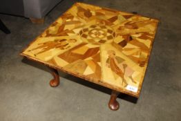 A coffee table inlaid with Dickensian figures