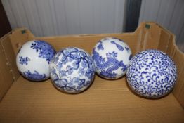 Four blue and white china spheres