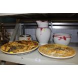 Two plaster wall plaques, a wash jug, chamber pot