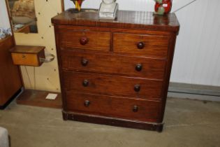 A Victorian mahogany chest of two short and three