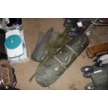 A carp fishing bivvy and landing net