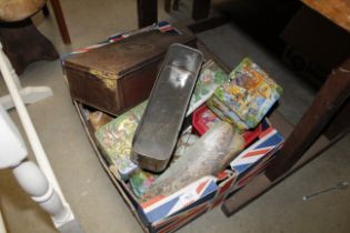 A collection of miscellaneous advertising tins