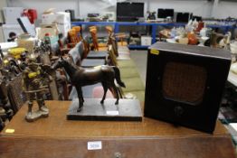A bronzed model of a horse; a vintage radio speake