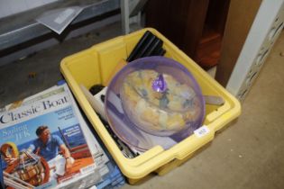 A box containing various cutlery and kitchen utens