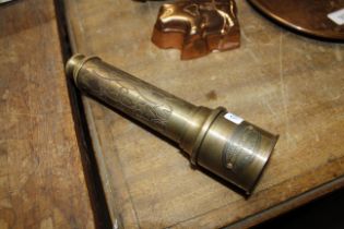 An engraved brass telescope