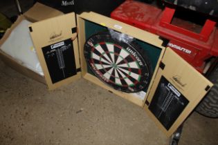 A Unicorn dartboard and fitted case