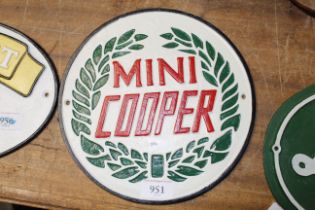A cast iron Mini Cooper plaque
