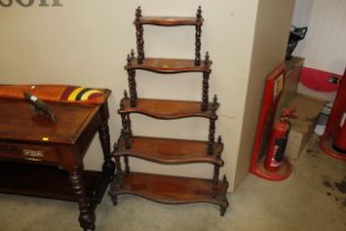 A Victorian mahogany graduated five tier whatnot