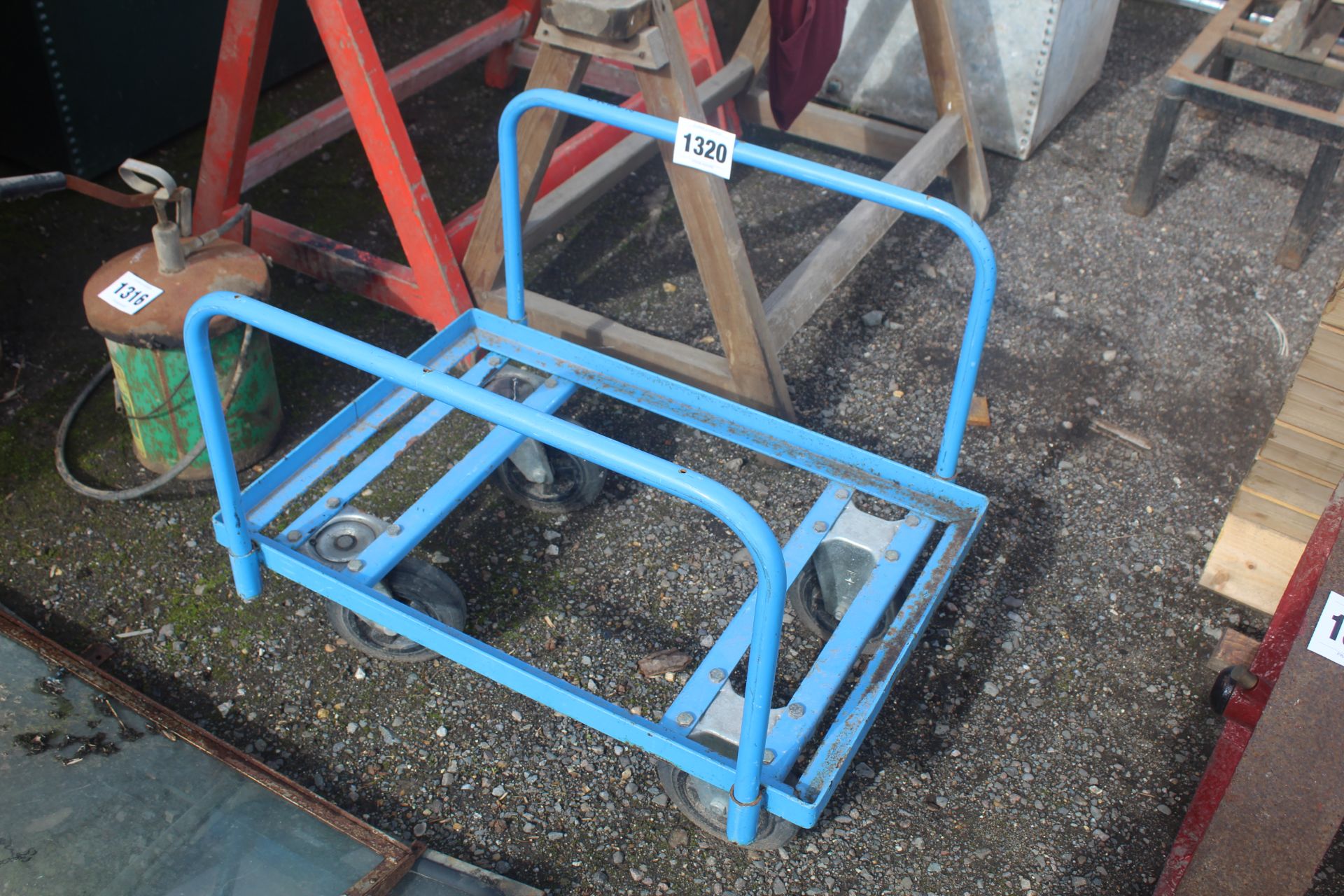 Four wheel trolley.