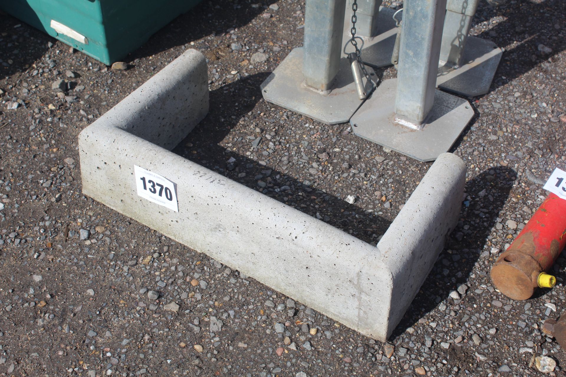 Concrete drain surround.