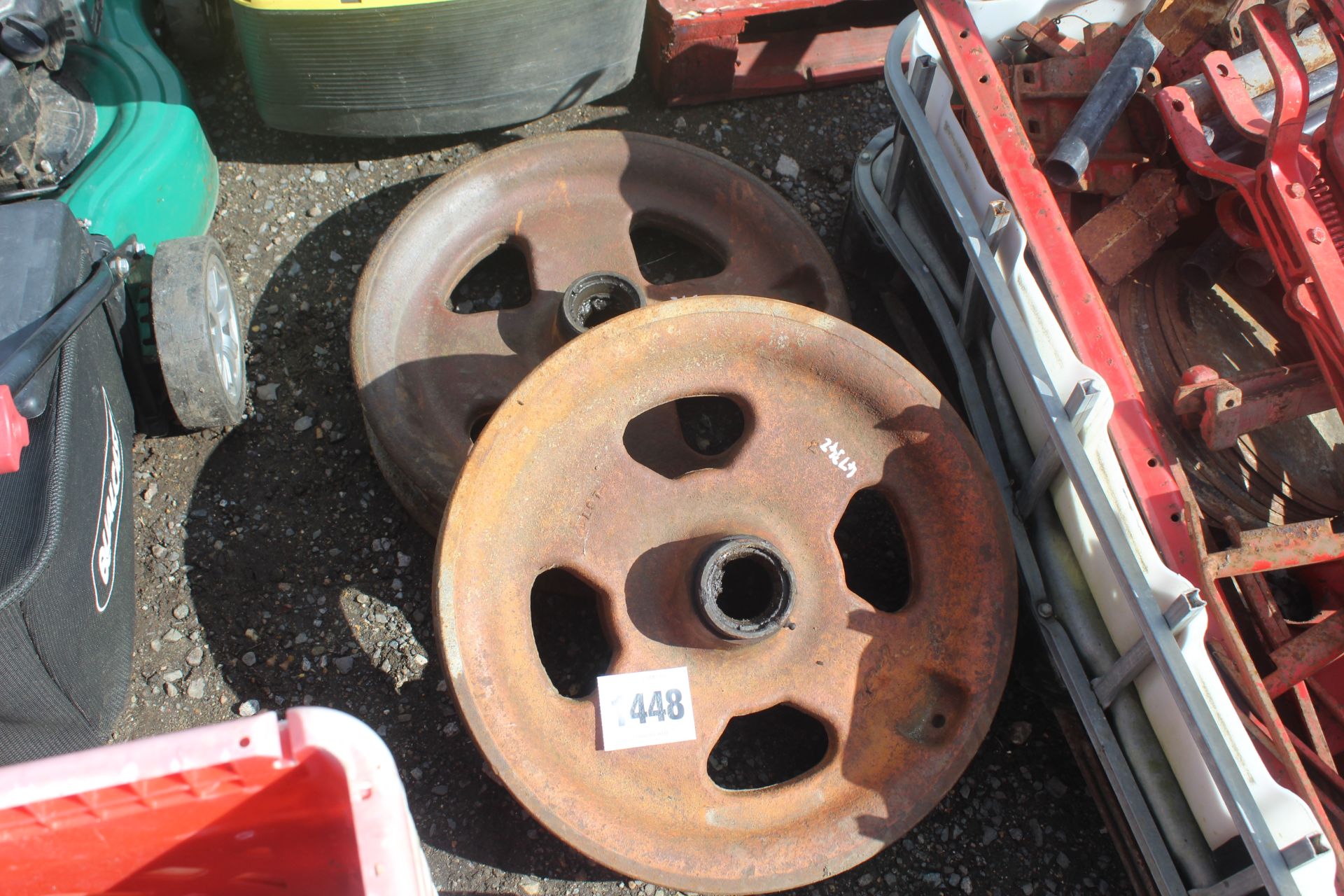 Pair of Fordson cast front wheels.