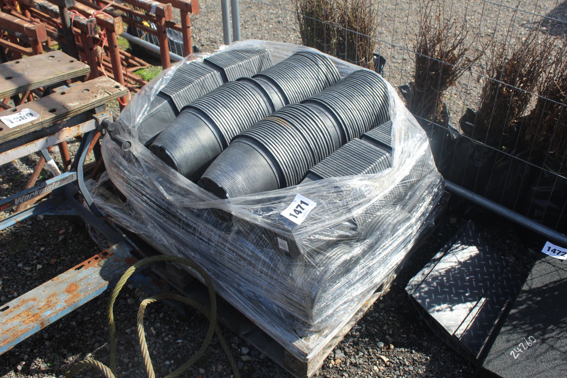 Pallet of unused decorative flower pots.