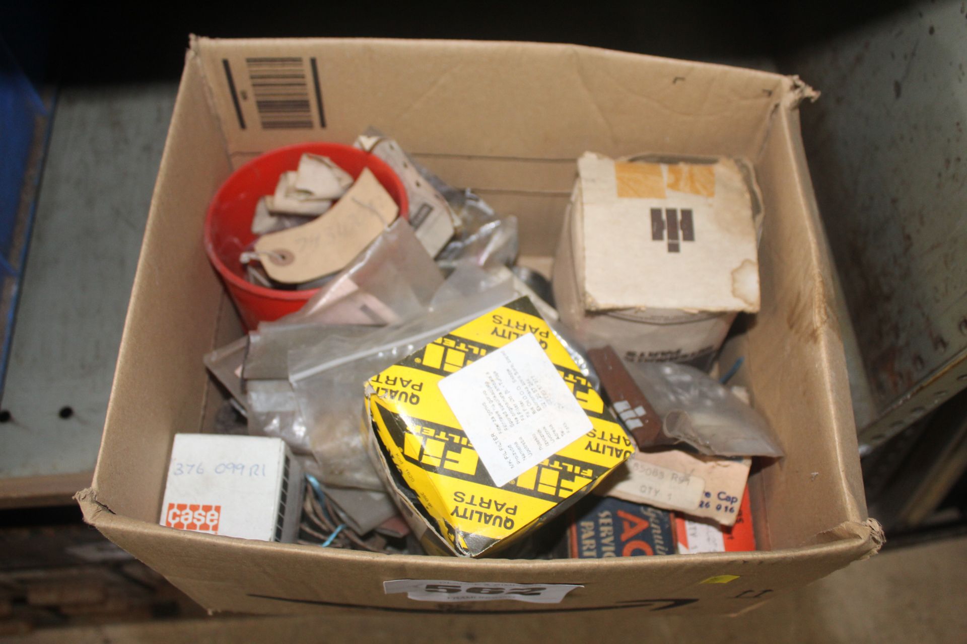 International Harvester box of unused spares.