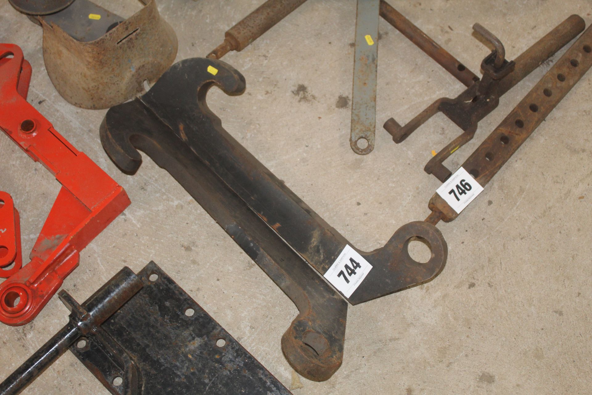 Pair of CAT loader brackets.