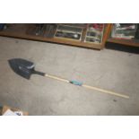 Long handled digging shovel. V