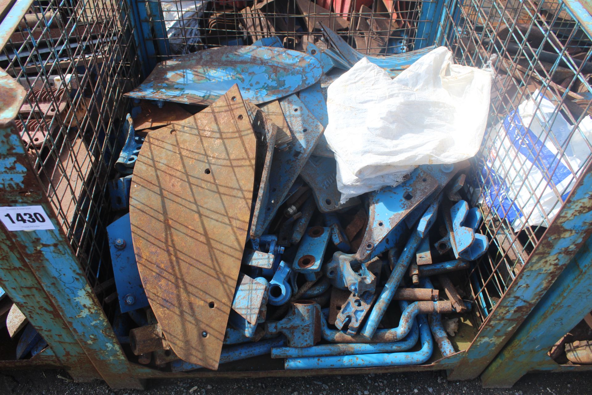 Stillage of NOS Ransomes coulter stalks, frogs, mouldboards etc.