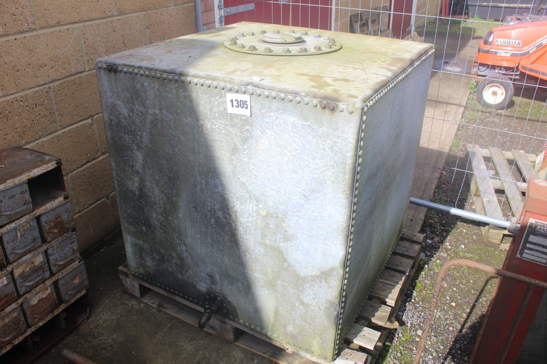 Large galvanised riveted tank. With tap and screw