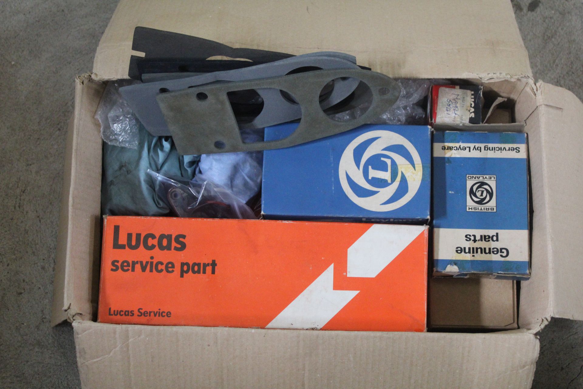 Box of MGB lamps and parts.