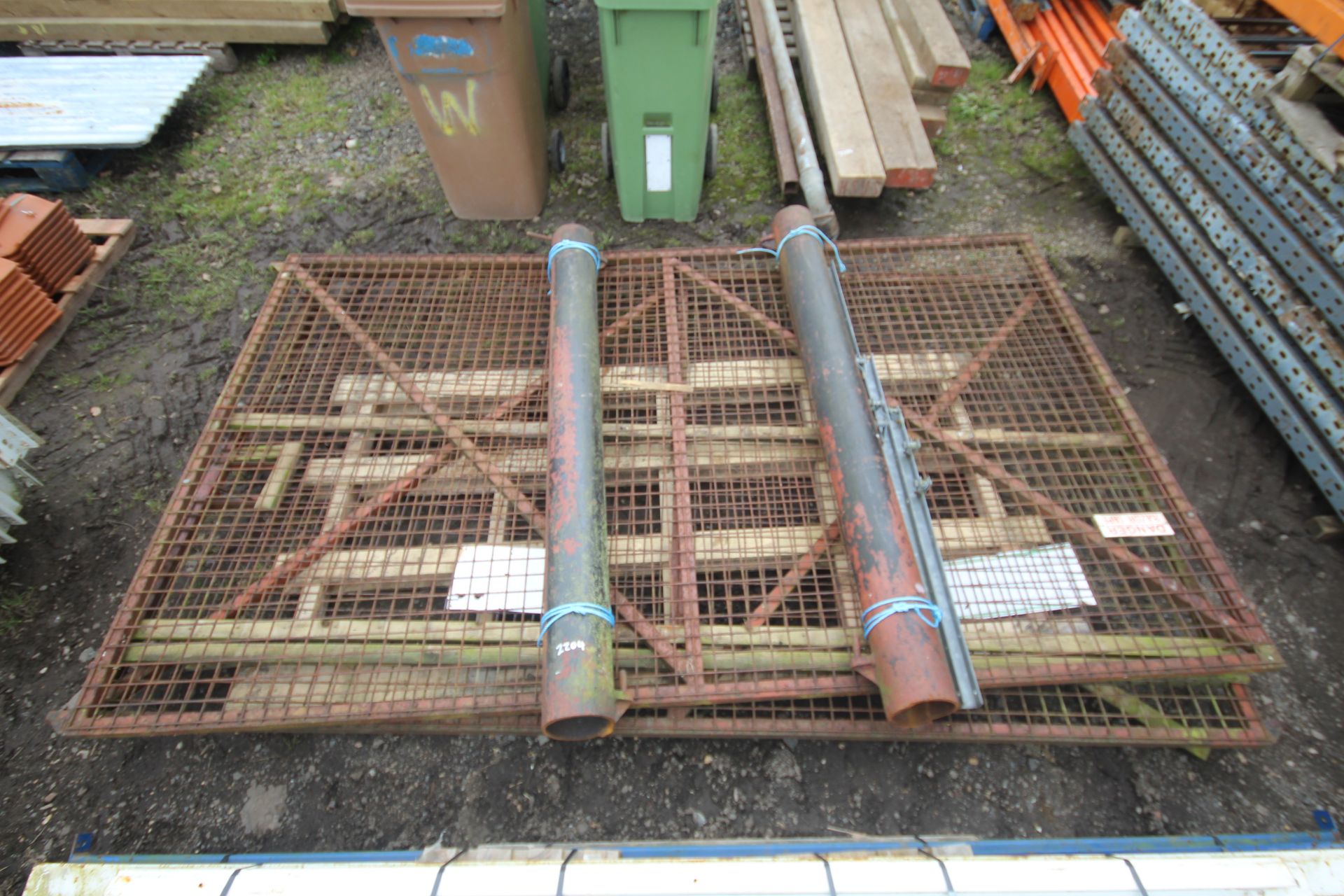 Pair of metal/ mesh gates. Approximately 3m x 1.8m. With posts (cut at ground level).